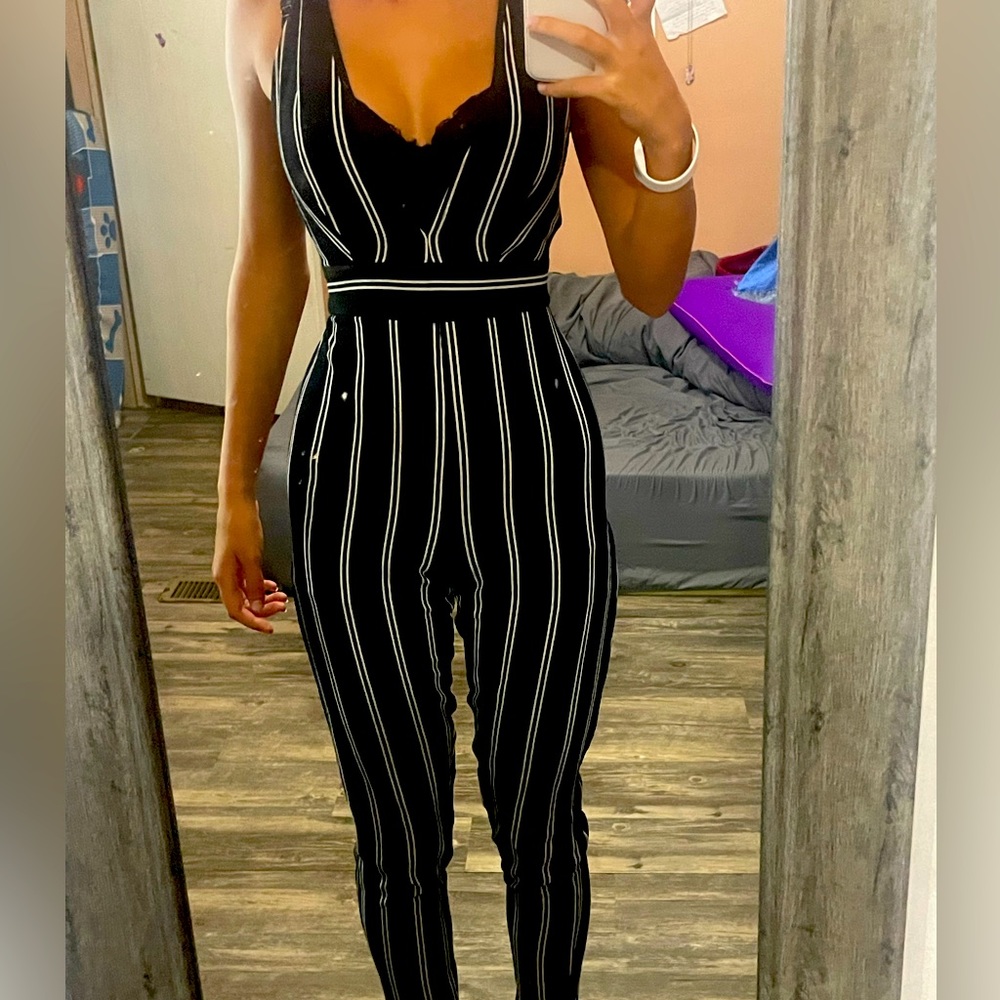 body suit brand is glare black and white stripped
